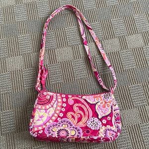 Red, pink and orange Vera Bradley over the shoulder bag.